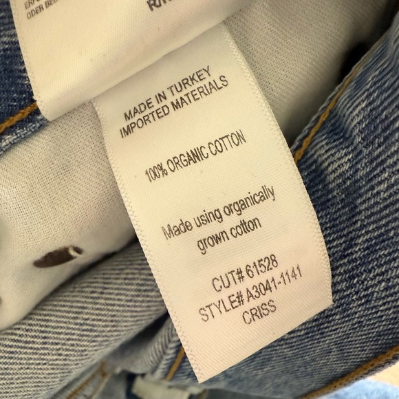 AGOLDE 90’s Criss Cross Denim Mini Skirt Button Fly Raw Hem Sz 27 - Picture 8 of 9